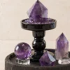 Close-up of amethyst point and sphere showing natural crystal texture