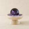 Stone Blessings amethyst sphere centerpiece on a textured stone vessel filled with chevron amethyst chips full front view