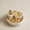 Citrine Three-Piece Set on Round Travertine Tray overhead view