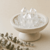 stone-blessings-clear-quartz-crystal-pedestal-bowl-styled-with-eucalyptus-leaves-in-a-calm-minimal-setting Stone Blessings clear quartz crystal pedestal bowl styled with eucalyptus leaves in a calm minimal setting