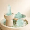 Fluorite Three Forms on Travertine showing tower, freeform and sphere