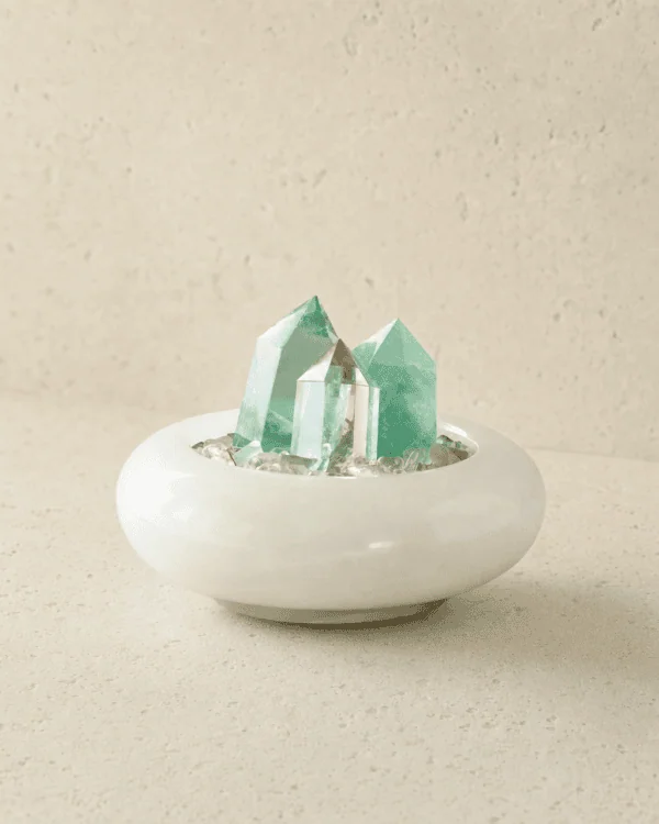stone-blessings-two-clear-quartz-towers-and-a-green-fluorite-tower-on-a-bed-of-clear-quartz-chips-in-an-afghan-jade-bowl-front-view Fluorite Vessel with Three Points