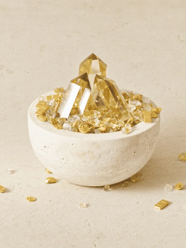 Stone Blessings natural citrine crystal bowl with a polished citrine tower in a stone vessel front view