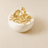 Stone Blessings top down view of a citrine crystal bowl with polished citrine towers and chips in a stone vessel