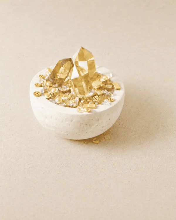 Stone Blessings top down view of a citrine crystal bowl with polished citrine towers and chips in a stone vessel
