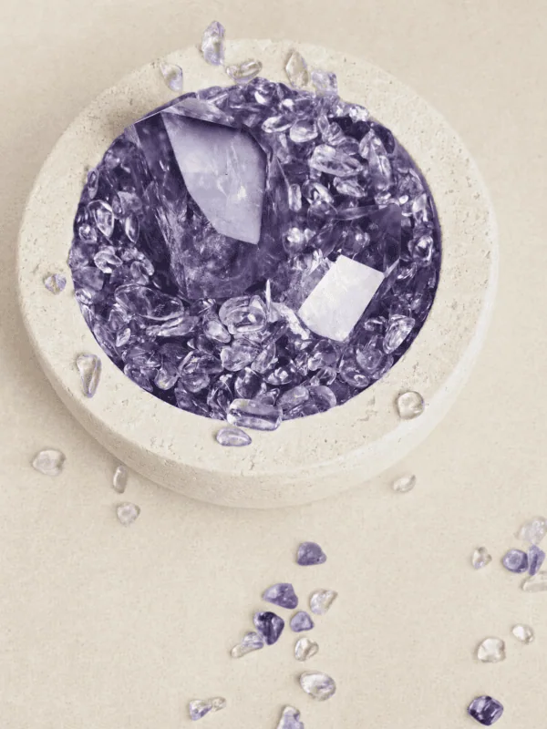stone-blessings-top-down-view-of-an-amethyst-crystal-bowl-with-a-polished-amethyst-tower-and-chevron-amethyst-chips-in-a-travertine-vessel Stone Blessings top down view of an amethyst crystal bowl with a polished amethyst tower and chevron amethyst chips in a travertine vessel