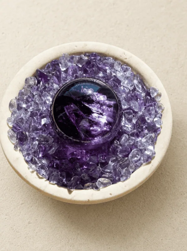 Stone Blessings top down view of an amethyst sphere centerpiece showing chevron amethyst chips in a stone vessel