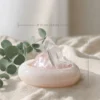 stone-blessings-rose-quartz-and-clear-quartz-crystal-bowl-styled-on-soft-cream-fabric-with-eucalyptus-leaves-in-a-calm-setting-with-size Rose Quartz Points in Pink Marble Vessel styled on soft cream fabric with eucalyptus and size reference